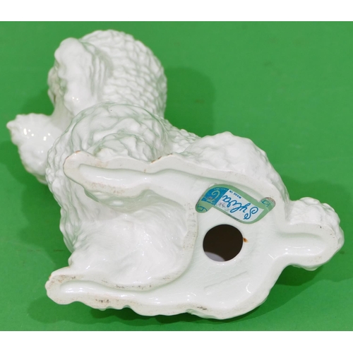 152 - A Sylvac China Figure of a seated poodle on white ground, 21cm high.