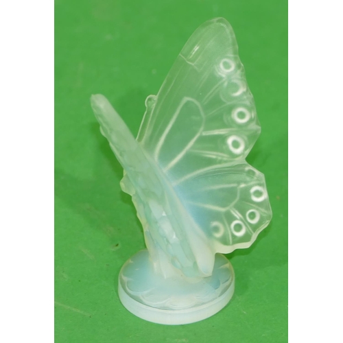 178 - A Sabino Lalique Style Opaque Glass Figure of a butterfly on round base, 6.8cm high.