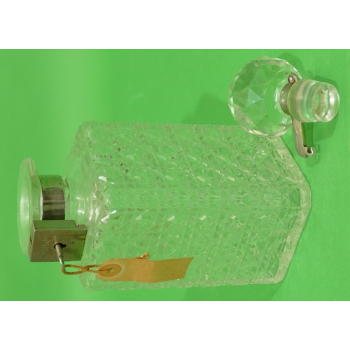 29 - A Square Cut Glass Decanter with stopper having lock-in neck, with key, 24.5cm high.