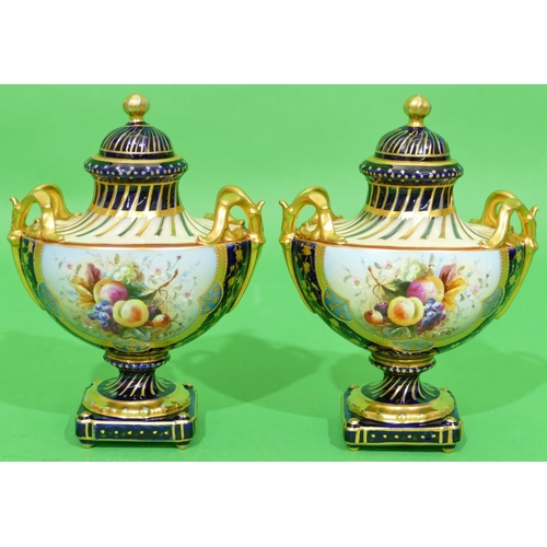 42 - A Pair of Continental Oval 2 Handled Lidded Vases on royal blue ground having multicoloured fruit an... 