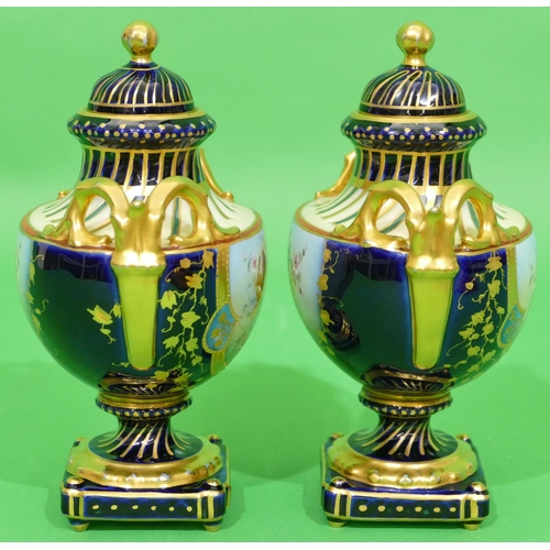 42 - A Pair of Continental Oval 2 Handled Lidded Vases on royal blue ground having multicoloured fruit an... 