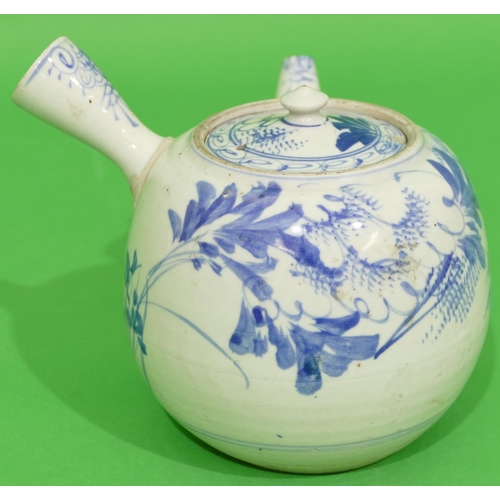 44 - An Oriental Round Bulbous Shaped Teapot with side handle on blue and white ground having floral and ... 