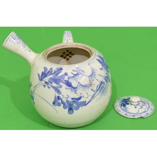 44 - An Oriental Round Bulbous Shaped Teapot with side handle on blue and white ground having floral and ... 