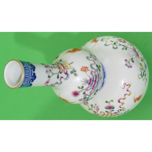 49 - An Oriental Gourd Shaped Vase on white and blue ground with multicoloured floral, leaf and bat decor... 