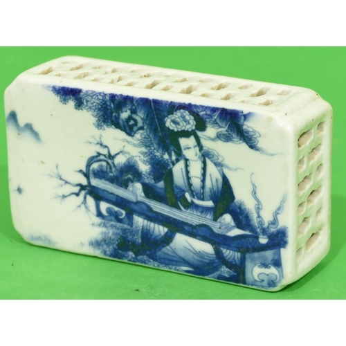 50 - An Oriental Blue and White Rectangular Shaped Paperweight having figure decoration, 13.2cm wide.