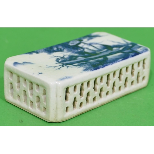 50 - An Oriental Blue and White Rectangular Shaped Paperweight having figure decoration, 13.2cm wide.