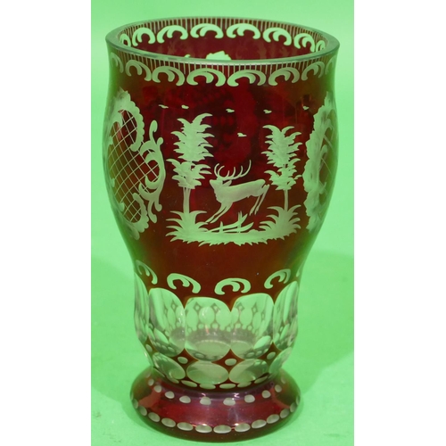 56 - A Ruby and Clear Glass Round Bulbous Shaped Beaker having animal, bird, shell, building and scroll d... 