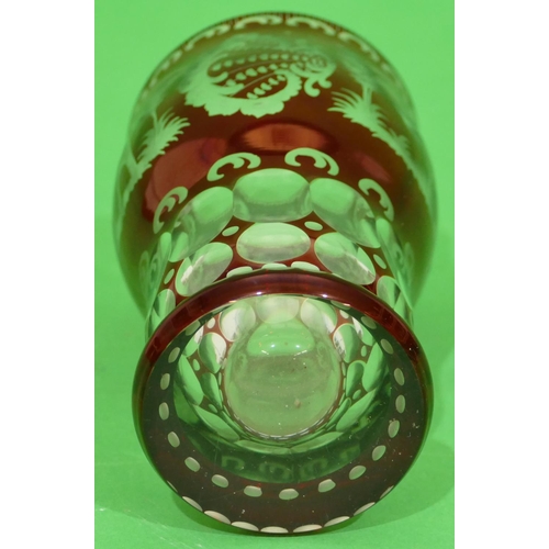 56 - A Ruby and Clear Glass Round Bulbous Shaped Beaker having animal, bird, shell, building and scroll d... 