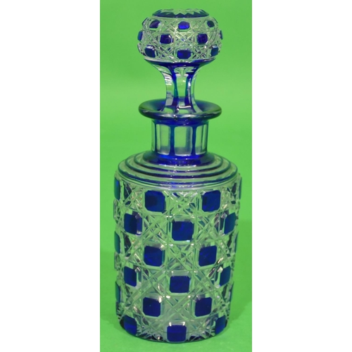 57 - A Blue and Clear Cut Glass Round Thin Necked Scent Bottle with stopper having thumb pattern decorati... 