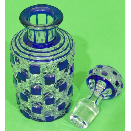 57 - A Blue and Clear Cut Glass Round Thin Necked Scent Bottle with stopper having thumb pattern decorati... 