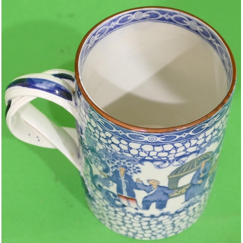 64 - An Adam's China Tankard having twist handle on blue and white ground with coloured bird, basket, flo... 