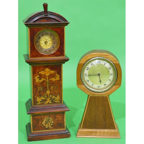 703 - A Miniature Longcase Clock Timepiece having floral and leaf decoration, dated 1907, 28cm high (no ha... 