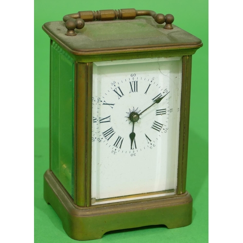 705 - A Brass Carriage Clock having white enamel dial with Roman and Arabic numerals (dial cracked) swing ... 