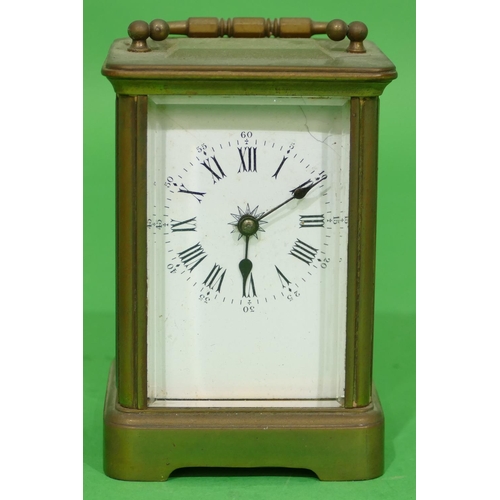 705 - A Brass Carriage Clock having white enamel dial with Roman and Arabic numerals (dial cracked) swing ... 