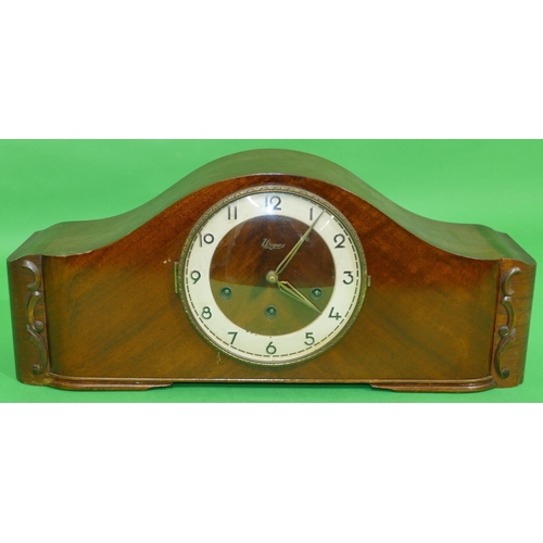 706 - An Urgos Mahogany 8 day Striking Westminster Chime Mantel Clock having arched top, Arabic numerals, ... 