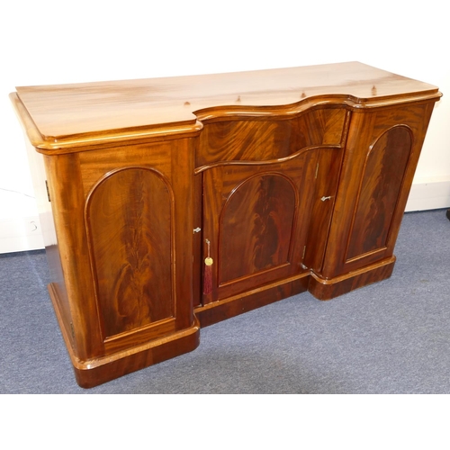 767 - A 19th Century Mahogany Serpentine Fronted Sideboard having centre drawer with panelled door below, ... 