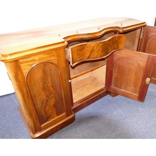 767 - A 19th Century Mahogany Serpentine Fronted Sideboard having centre drawer with panelled door below, ... 