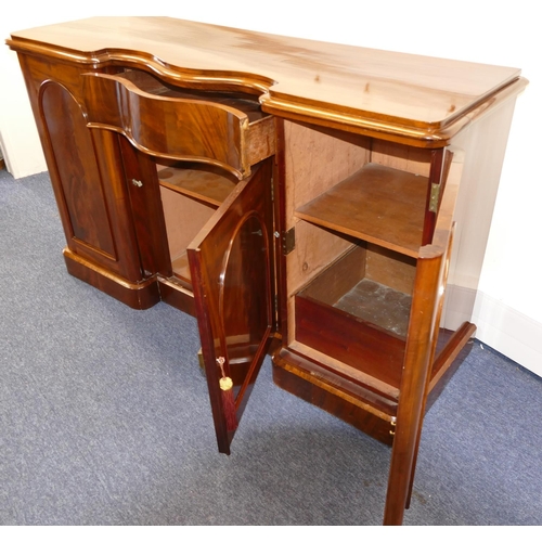 767 - A 19th Century Mahogany Serpentine Fronted Sideboard having centre drawer with panelled door below, ... 