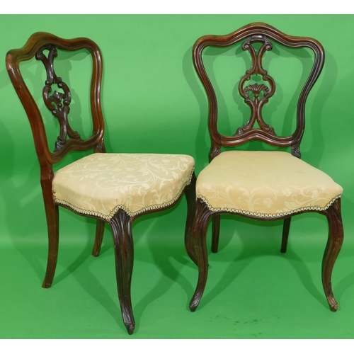 771 - A Pair of 19th Century Rosewood Open Back Single Chairs having pierced splat backs, cream over stuff... 