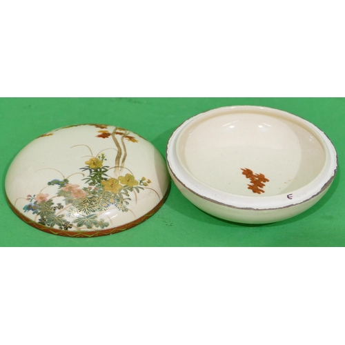 89 - An Oriental Satsuma Round Lidded Box on cream ground with multicoloured floral leaf and gilt decorat... 