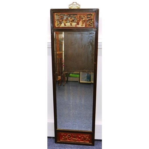 773 - An Oriental Hardwood Hanging Bevelled Wall Mirror with carved red and gilt figure motif, 1m 38.5cm h... 