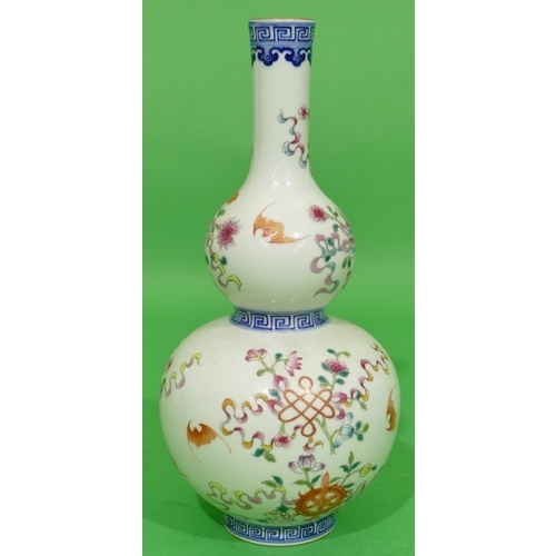 49 - An Oriental Gourd Shaped Vase on white and blue ground with multicoloured floral, leaf and bat decor... 