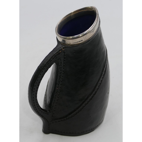 109 - A Royal Doulton silver rimmed black jug imitating a leather jack (marks rubbed) with Sterling silver... 