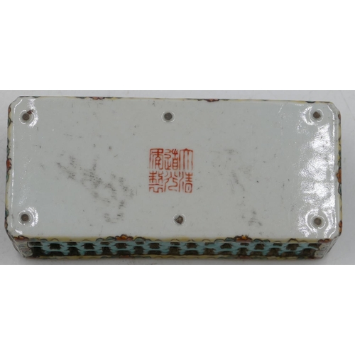 114 - An Oriental rectangular shaped scroll weight with pierced and coloured dragon, floral and scroll dec... 