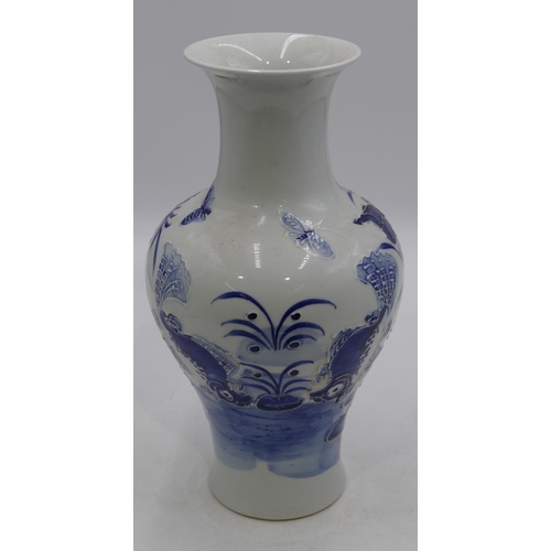 116 - An Oriental round bulbous thin necked trumpet shaped vase on blue and white ground with raised insec... 