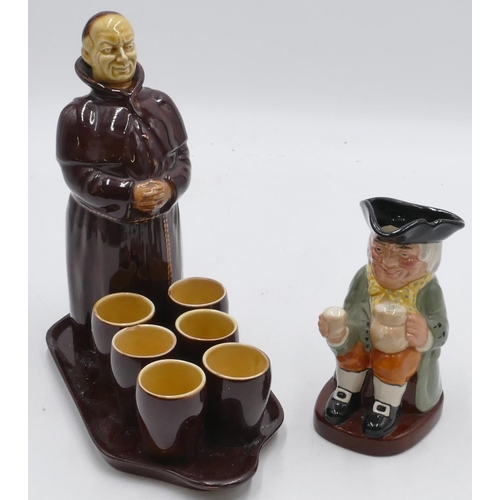 12 - A Beswick bottle in the form of a monk with removable head, 21cm high, standing on scallop shaped tr... 