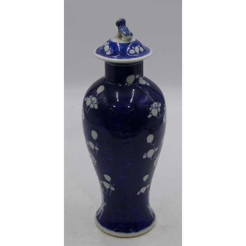 122 - A 19th Century Oriental round bulbous thin necked vase with later cover, on white and blue ground wi... 