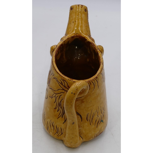 125 - Horace Elliott, Ewenny pottery yellow glazed scraffito decorated zoomorphic jug in form of a caricat... 