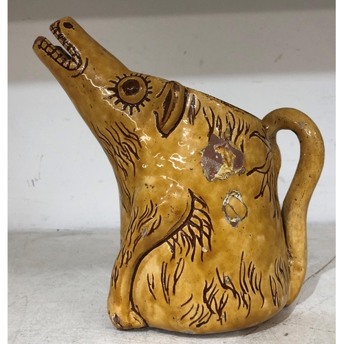 125 - Horace Elliott, Ewenny pottery yellow glazed scraffito decorated zoomorphic jug in form of a caricat... 