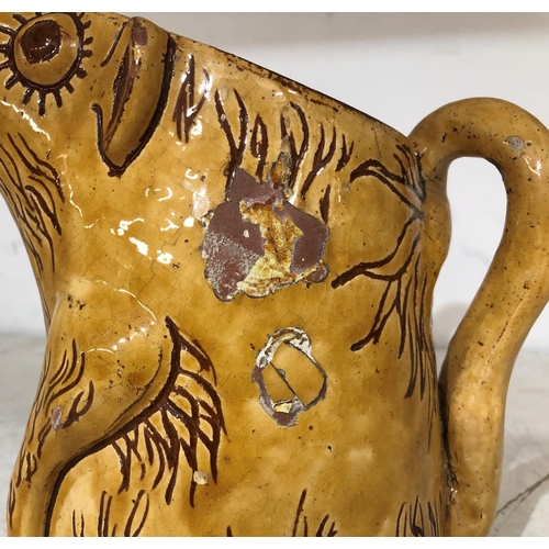 125 - Horace Elliott, Ewenny pottery yellow glazed scraffito decorated zoomorphic jug in form of a caricat... 