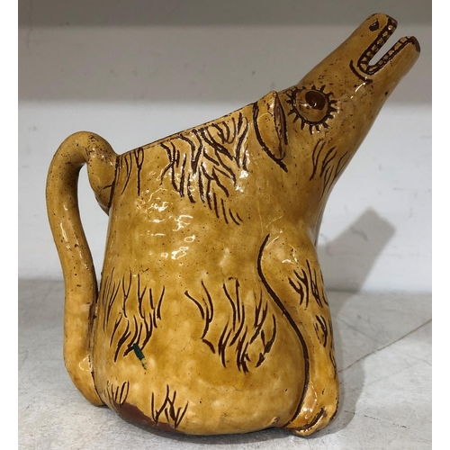 125 - Horace Elliott, Ewenny pottery yellow glazed scraffito decorated zoomorphic jug in form of a caricat... 