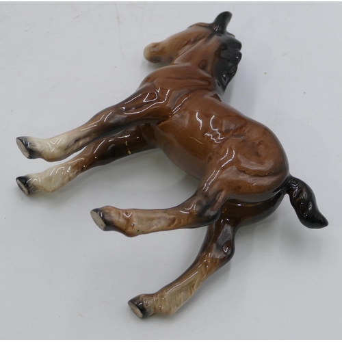 135 - 3 Beswick figures of foals, largest 15cm long, 15cm high. (3)