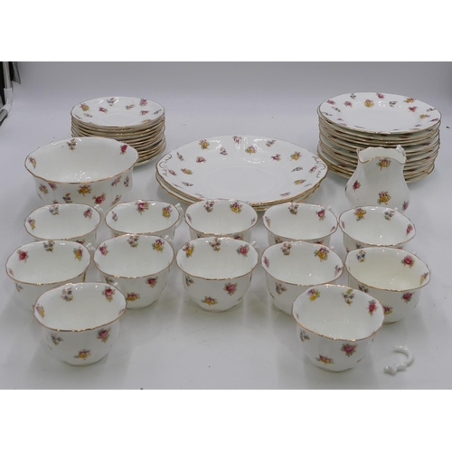 146 - W.A.A & Co tea service on white ground with multicolour floral and leaf decoration comprising a pair... 