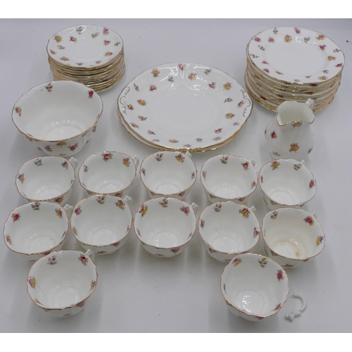 146 - W.A.A & Co tea service on white ground with multicolour floral and leaf decoration comprising a pair... 