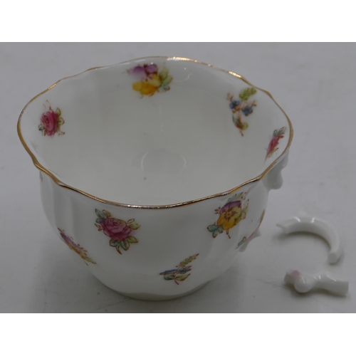 146 - W.A.A & Co tea service on white ground with multicolour floral and leaf decoration comprising a pair... 