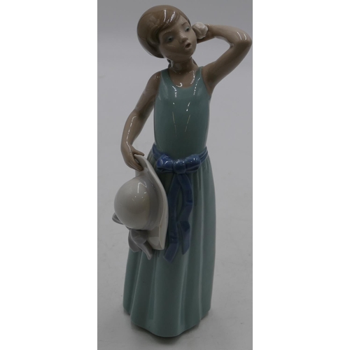 155 - A Lladro figure of a young girl holding a flower and bonnet, 24cm high