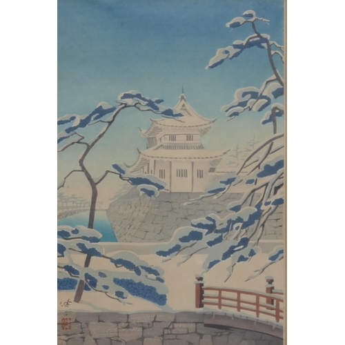 210 - An Oriental coloured woodblock print depicting building in snowy landscape, signed, framed, 36.5 x 2... 