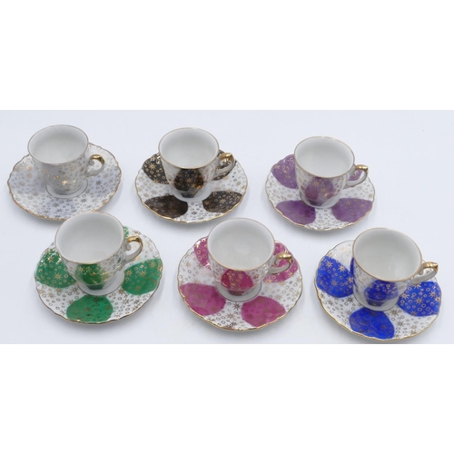22 - A set of 6 Bavarian Winterling coffee cups and saucers on various coloured ground, all with gilt dec... 