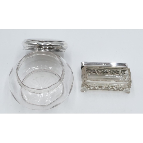 231 - A plain glass round bulbous dressing table bottle with London silver top, a rectangular cut glass dr... 