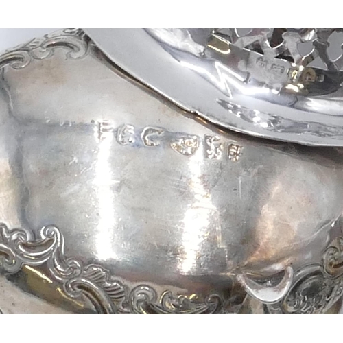 232 - A George III silver sauce boat (handle missing) with allover embossed floral and scroll decoration a... 