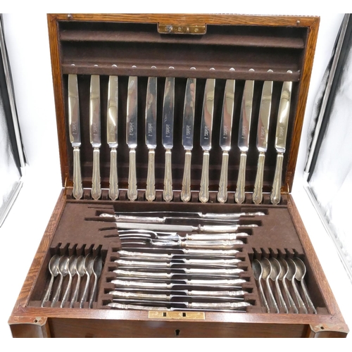 235 - An Argyle silver plated 12 place setting flatware service in fitted oak canteen with hinged lid and ... 