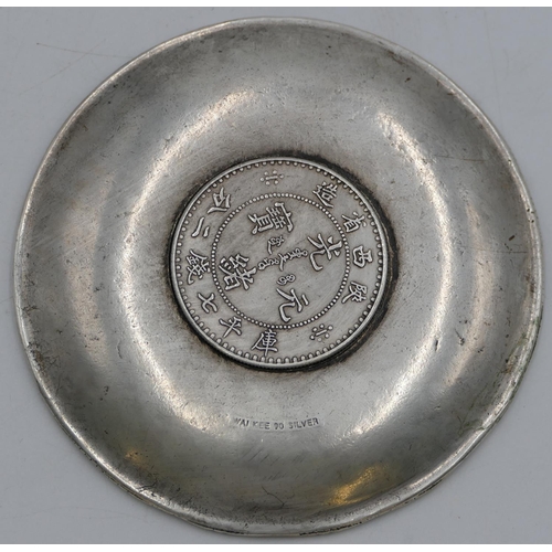 241 - An Oriental small round dish depicting raised Zodiac figures, inscribed to reverse Wai Kee, 10cm wid... 