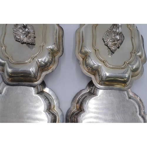 242 - A pair of silver plated rectangular scallop shaped entree dishes with covers, 31cm wide.