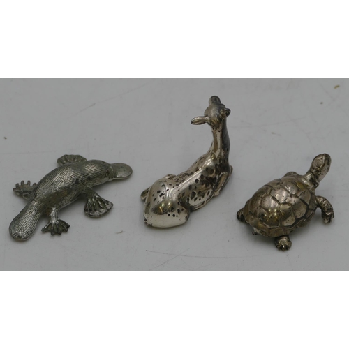 255 - A miniature 800 silver coloured metal model of a deer, 3cm high and 2 other metal figures of animals... 