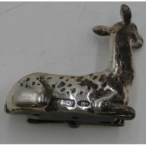 255 - A miniature 800 silver coloured metal model of a deer, 3cm high and 2 other metal figures of animals... 