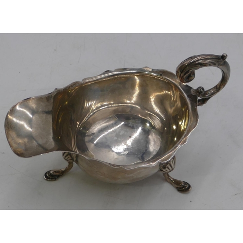 270 - A Birmingham silver sauceboat with crickle rim, scroll handle and splayed feet 2.6oz